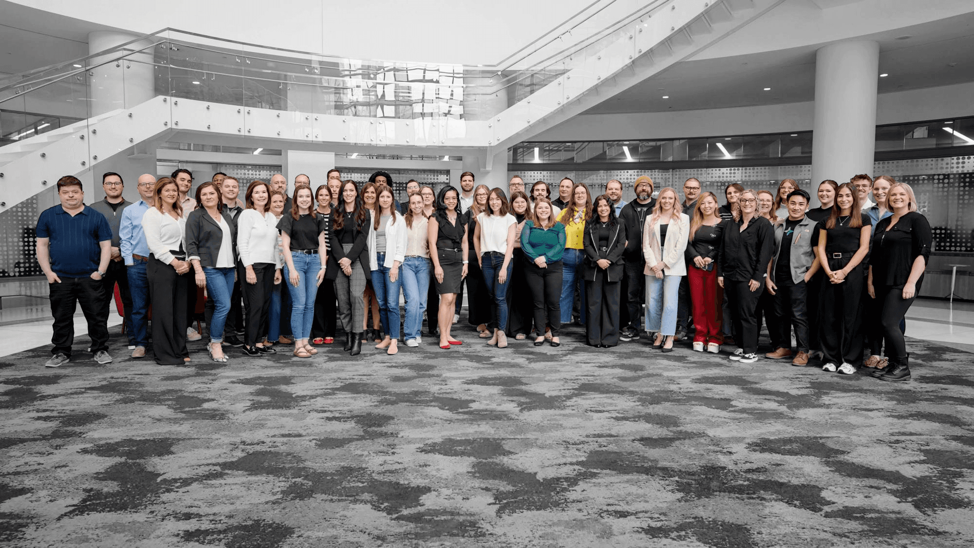 Team group photo inside the lobby of Capella Tower